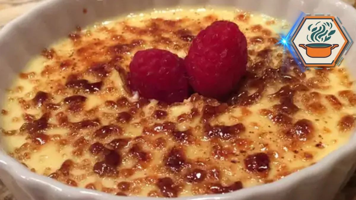 Crème brûlée with caramelized sugar topping, garnished with fresh raspberries, served in a white ramekin.