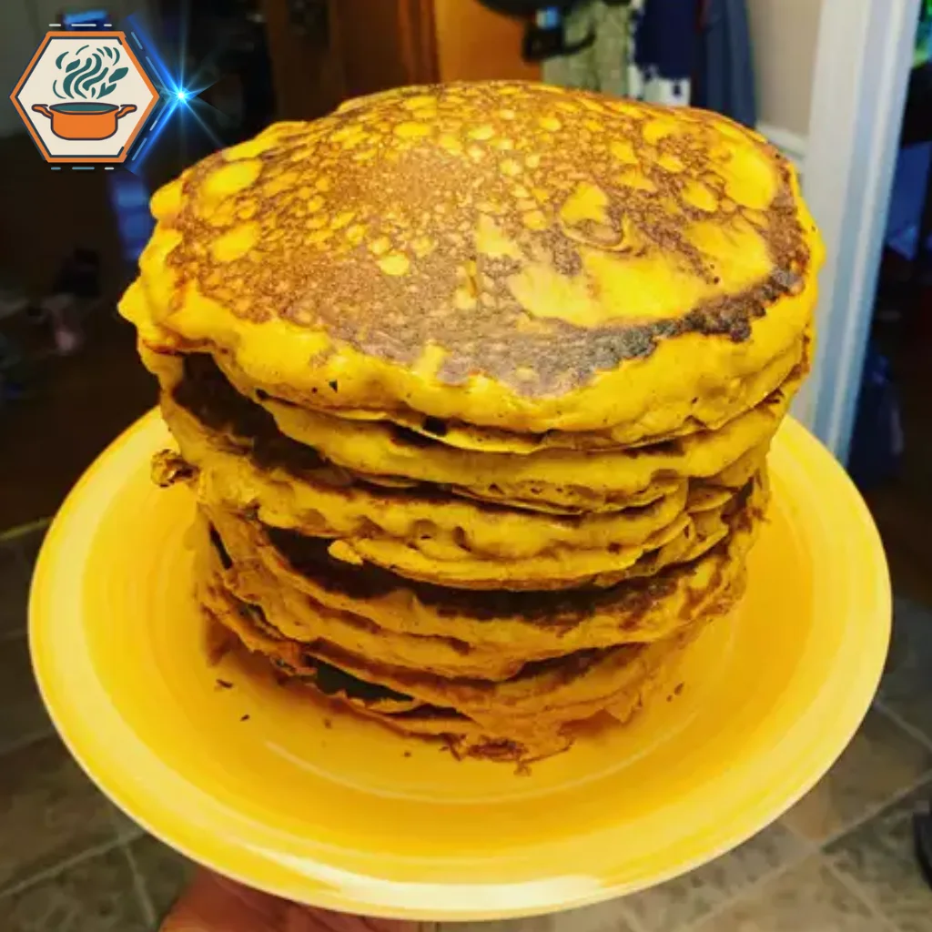 title="What Is a Crispy Pancake Called? Discover This Breakfast Treat" alt="Towering stack of crispy golden-brown pancakes on a vibrant yellow plate, highlighting a delicious and perfectly cooked breakfast treat."