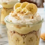 3-Ingredient Banana Pudding Cups in glass cups on white marble countertop