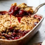 Two-Ingredient Cherry Dump Cake with golden crust and cherry filling