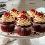 Ultimate Red Velvet Cupcakes with cream cheese frosting on white marble countertop