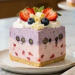 Blueberry Strawberry Cheesecake Delight with layered berry fillings and whipped cream