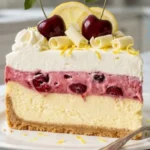 Cherry Lemon Dream Cheesecake Lush with lemon cheesecake, cherry cream and whipped topping.