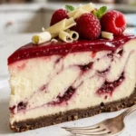 Full white chocolate raspberry cheesecake with glossy raspberry topping