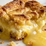 4-Ingredient Lemon Cream Cheese Dump Cake with golden crust and gooey lemon filling