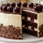 Black Forest Cherry Cream Layer Cake with chocolate sponge, vanilla cream, cherry filling, ganache, and fresh cherries