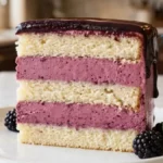 Blackberry Mousse Cake with vanilla layers and glossy blackberry chocolate topping