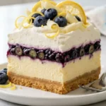 Blueberry Lemon Cream Dream served on a white plate with whipped cream and fresh blueberries.