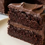Homemade Chocolate Fudge Cake with two moist chocolate layers and thick fudge frosting