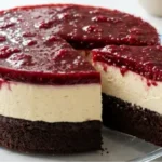 Chocolate Raspberry Cream Layer Cake with chocolate base, vanilla cream and raspberry topping