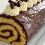 Chocolate Vanilla Swiss Roll with chocolate ganache and vanilla cream on a white marble kitchen counter