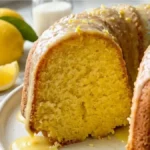 Easy Lemon 7-Up Bundt Cake with homemade lemon glaze on white marble countertop