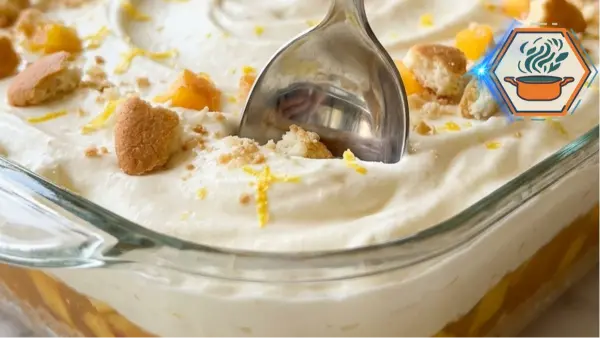 Lemon Peach Cheesecake Cream Lush 2 Lemon Peach Cheesecake Cream Lush in a glass dish with peaches and vanilla wafer crumbs