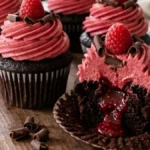 Midnight Raspberry Lava Cupcake with raspberry filling and pink buttercream