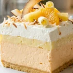 Orange Pineapple Creamsicle Lush with pineapple cream and toasted coconut
