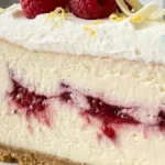 Raspberry Lemon Cream Cheesecake Dream slice with raspberry swirl and lemon cream