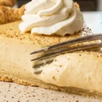 Old Fashioned Custard Pie served on white marble countertop