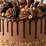 Chocolate Hazelnut Crunch Celebration Cake with ganache drips and toasted hazelnuts